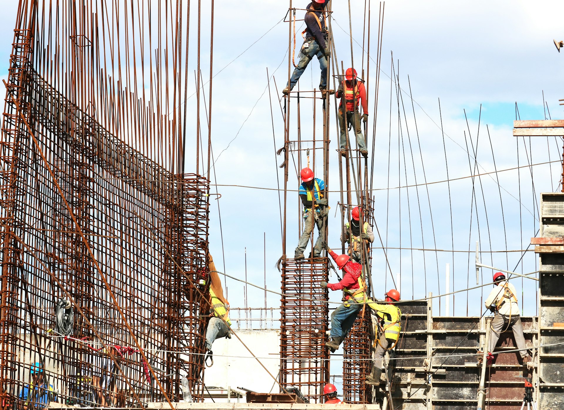 people working on building during daytime constructing in sargodha 